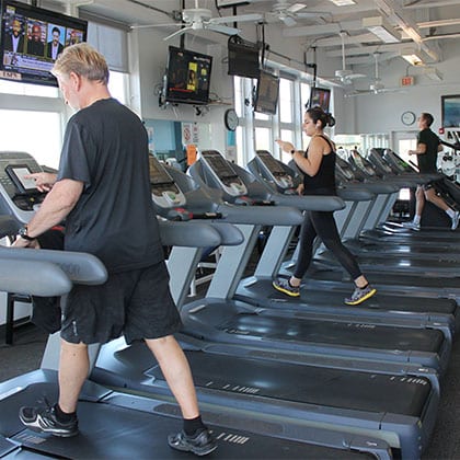 people working out on treadmills